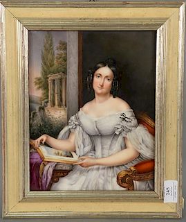 Painting on porcelain plaque of seated woman reading a book. 
11 1/4" x 8 3/4"