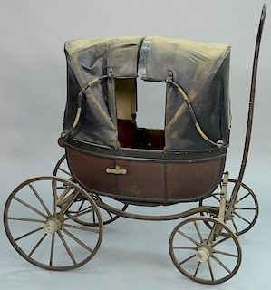 Child's carriage with two seats and double hooded top and pull handle. 
height 42 inches
