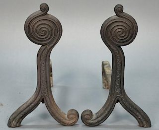 Pair of iron andirons with swirl circle tops, marked C.A. Wellington 1886.   height 16 1/2 inches