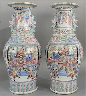 Pair of large rose famille porcelain vases, having painted warrior and scholar panel on each side amongst molded dragons and