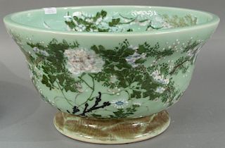 Celadon porcelain punch bowl on footed base. 
height 10 inches, diameter 18 inches 
Provenance: 
From the Estate of Faith K.