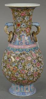 Small Chinese famille rose vase having painted flower and scrolling vines, molded dragon and ring handles, seal mark on botto