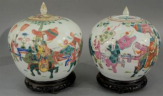 Pair of famille rose covered jars, painted with children and bats (one cover as is).   height 9 inches   Provenance: The Est.