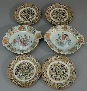 Six piece lot to include rose famille oyster plates and four small rose famille butterfly plates. 
(2) diameter 8 inches 
(4)