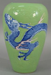 Large green glazed Chinese dragon vase having green ground with scrolling clouds and blue and white three claw dragon, impres