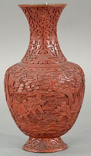 Chinese cinnabar lacquer vase with scrolling pines and boys playing. 
height 10 inches 
Provenance: 
From the Estate of Faith