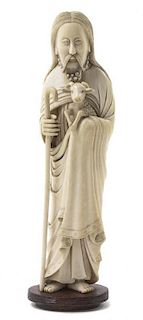 A Chinese Carved Ivory Western Subject Figure, Height 8 3/4 inches.