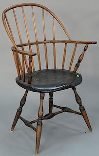 Windsor sack back armchair on bold turned legs with H stretcher, having traces of old black paint. 
total height 38 inches, s