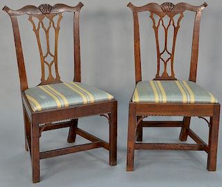 Pair of cherry Chippendale side chairs having shell carved crest with pierce carved splats over slip seats on frames with gar