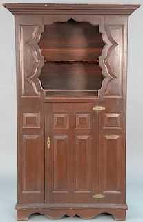 Pine cupboard having open top and door all with raised panel front, set on bracket feet. 
height 77 inches, total width 46 1/