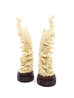A Pair of Chinese Carved Ivory Phoenixes, Height 10 inches.