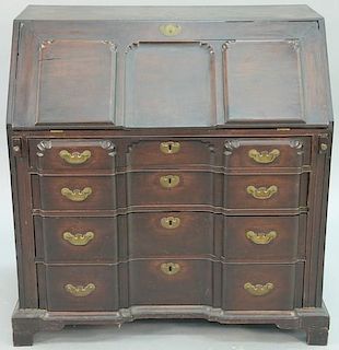 Chippendale mahogany block front desk having unusual block front lid over four recurring block front drawers set on bracket b