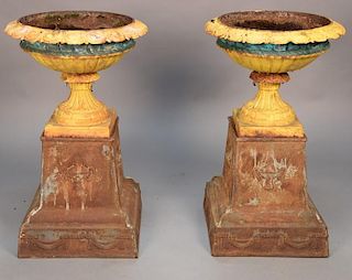 Pair of Victorian iron urns on stands. 
height 36 inches, diameter 21 inches