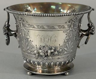 Coin silver pot with lion handles with rings and repousse body, all on round base and suppressed ball feet. 
height 4 3/8 inc