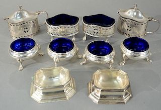 Five pairs of silver salts, all with liners, eight cobalt and two clear, along with two spoons.  cobalt: height 1 1/2 inches