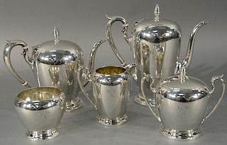 Five piece sterling silver tea and coffee set having pineapple finials (monogrammed). 
tallest height 9 3/4 inches, 96 troy o