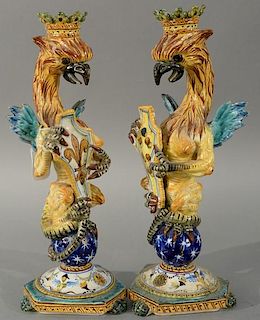 Pair of Majolica candlesticks having winged dragon on sphere, Italian or Portuguese. 
height 13 1/2 inches 
Provenance: 
From