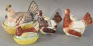 Four Staffordshire chickens, two with chicks on backs, and under. 
length of largest: 10 inches 
length of smallest: 5 1/2 in