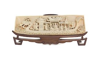 A Chinese Relief Carved Ivory Wrist Rest, Height 2 5/8 x width 9 inches.