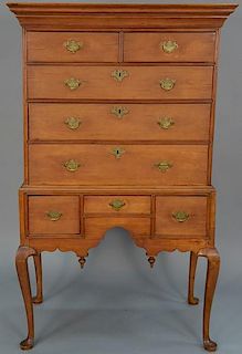 Queen Anne cherry highboy in two parts, upper portion having document drawer in cornice molding over two short drawers over t