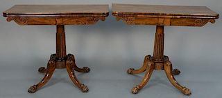 Pair of rosewood gaming tables having felt interiors with scroll carved front skirt on fluted pedestal, set on base with four