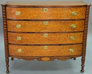 Sheraton bowed front chest with birdseye maple fronts and turret corners, circa 1830. 
height 39 1/2 inches, width 44 inches