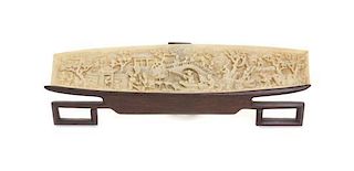 A Chinese Relief Carved Ivory Wrist Rest, Height 2 1/8 x width 9 1/4 inches.