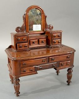 Miniature mahogany vanity and mirror, early 20th century. 
height 14 inches, width 11 1/2 inches