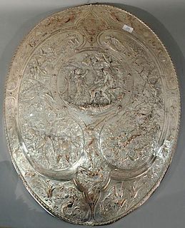 Milton silver plated oval shield replica by Elkington depicting various scenes from John Miltons Paradise Lost.