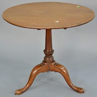 Federal cherry tip table having round top on vase turned shaft set on tripod base.   height 27 1/4 inches, diameter 30 inches