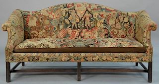 George II mahogany sofa with camel back and rolled arms, upholstered in needlepoint (upholstery as is).  height 38 inches, wi
