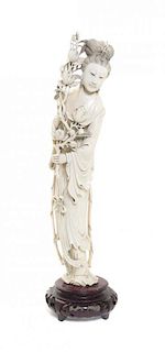 A Chinese Carved Ivory Figure of a Lady, Height 16 1/2 inches.