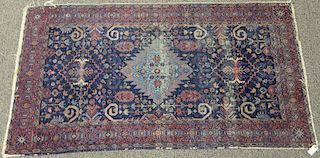 Oriental throw rug (wear). 
3'10" x 7'