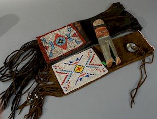 Three piece lot to include Hopi Kachina polychrome carved wood doll and two beaded bags. 
height 9 3/4 inches