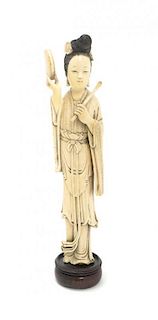 A Chinese Carved Ivory Figure of a Musician, Height 10 3/4 inches.