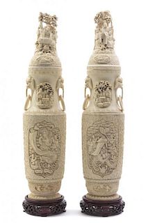 A Pair of Carved Ivory Covered Urns, Height 24 1/2 inches.