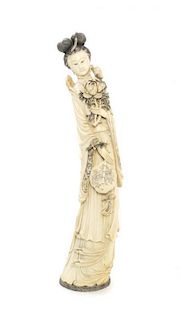 A Chinese Carved Ivory Figure of a Lady, Height 26 3/4 inches.