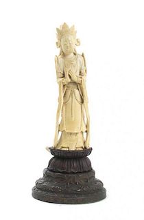 A Chinese Carved Ivory Figure of a Buddhist Deity, Height 8 1/2 inches.