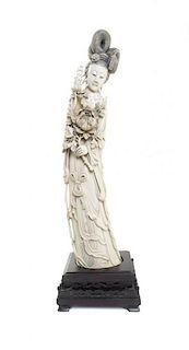 A Chinese Carved Ivory Figure of a Lady, Height 22 inches.