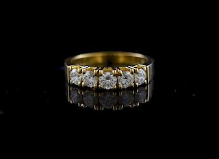 Stamped 18k yellow gold five stone diamond ring