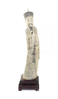 A Chinese Carved Ivory Figure of an Emperor, Height 26 inches.
