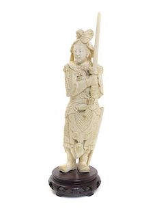 A Chinese Carved Ivory Figure of a Warrior, Height 11 1/2 inches.
