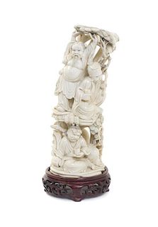 A Chinese Carved Ivory Figural Group, Height 10 inches.