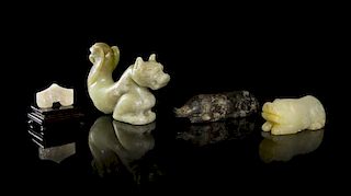 A Group of Archaistic Jade Carvings, Width of longest 4 1/2 inches.