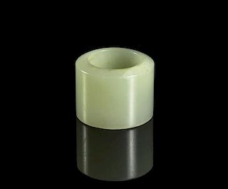 A Celadon Jade Archers Ring, Diameter 1 1/4 inches.