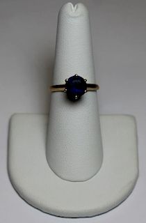 JEWELRY. 14kt Gold and Solitaire Sapphire Ring.