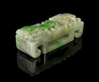 A Carved Jade Scabbard Slide, Width 3 1/2 inches.