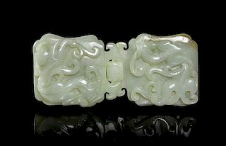 A Carved Jade Belt Buckle, Width overall 4 3/4 inches.