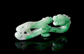 A Carved Jadeite Belthook, Length 3 3/4 inches.