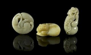 Three Carved Jade Toggles, Height of tallest 2 5/8 inches.